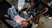 Indonesia free meals program under fire after thousands sickened